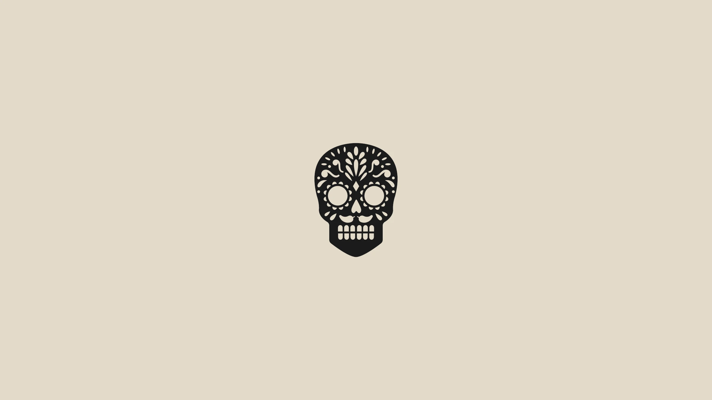 The Foundry sugar-skull icon in solid black on cream