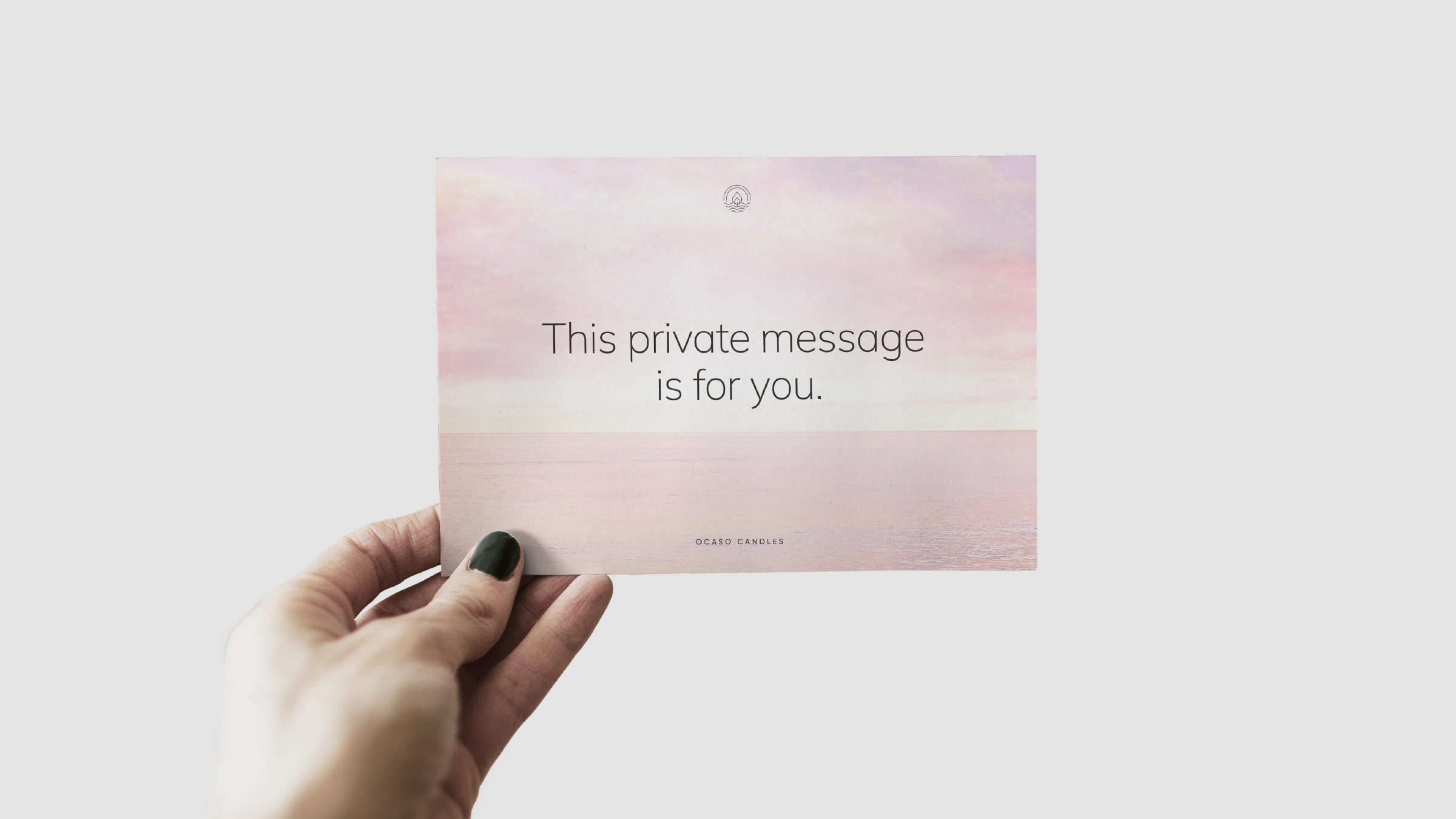 The Secret — a private message card held in hand