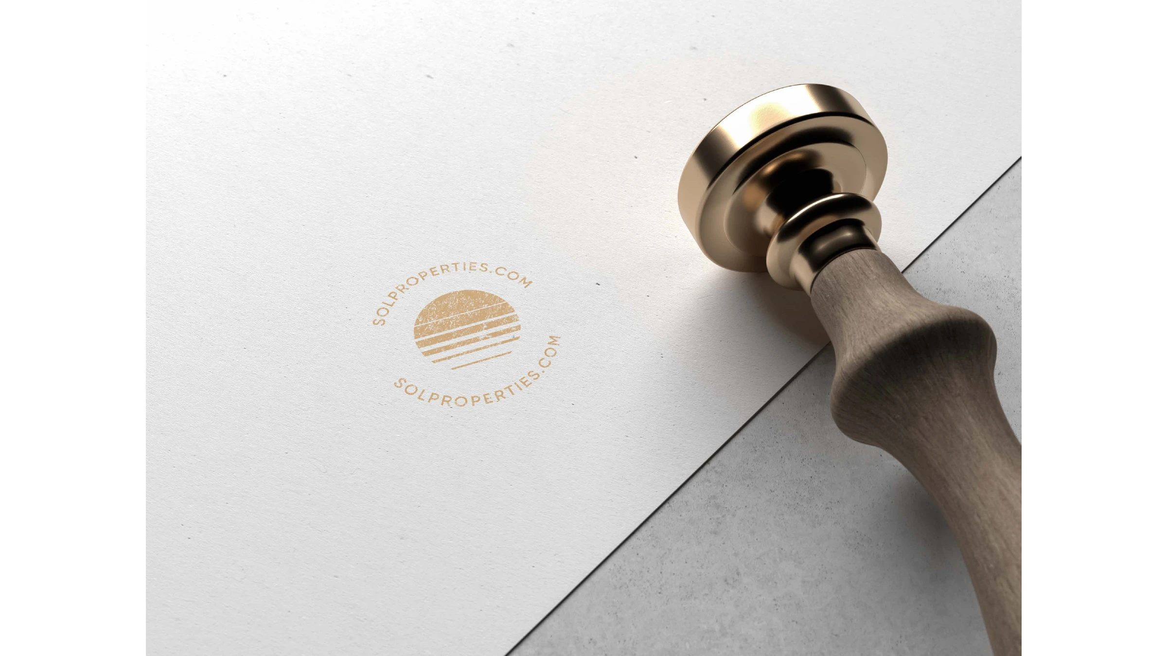 The gold Sol Properties wax-style stamp pressed on paper
