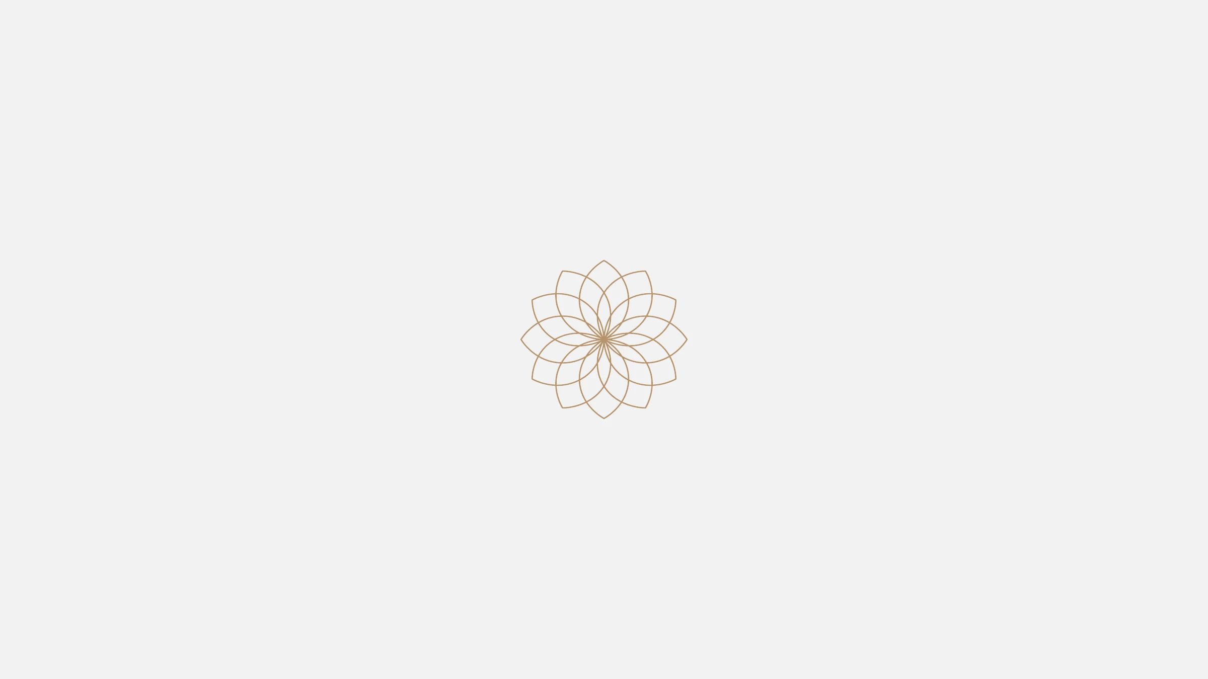The refined Statera lotus-mandala mark in gold on light grey