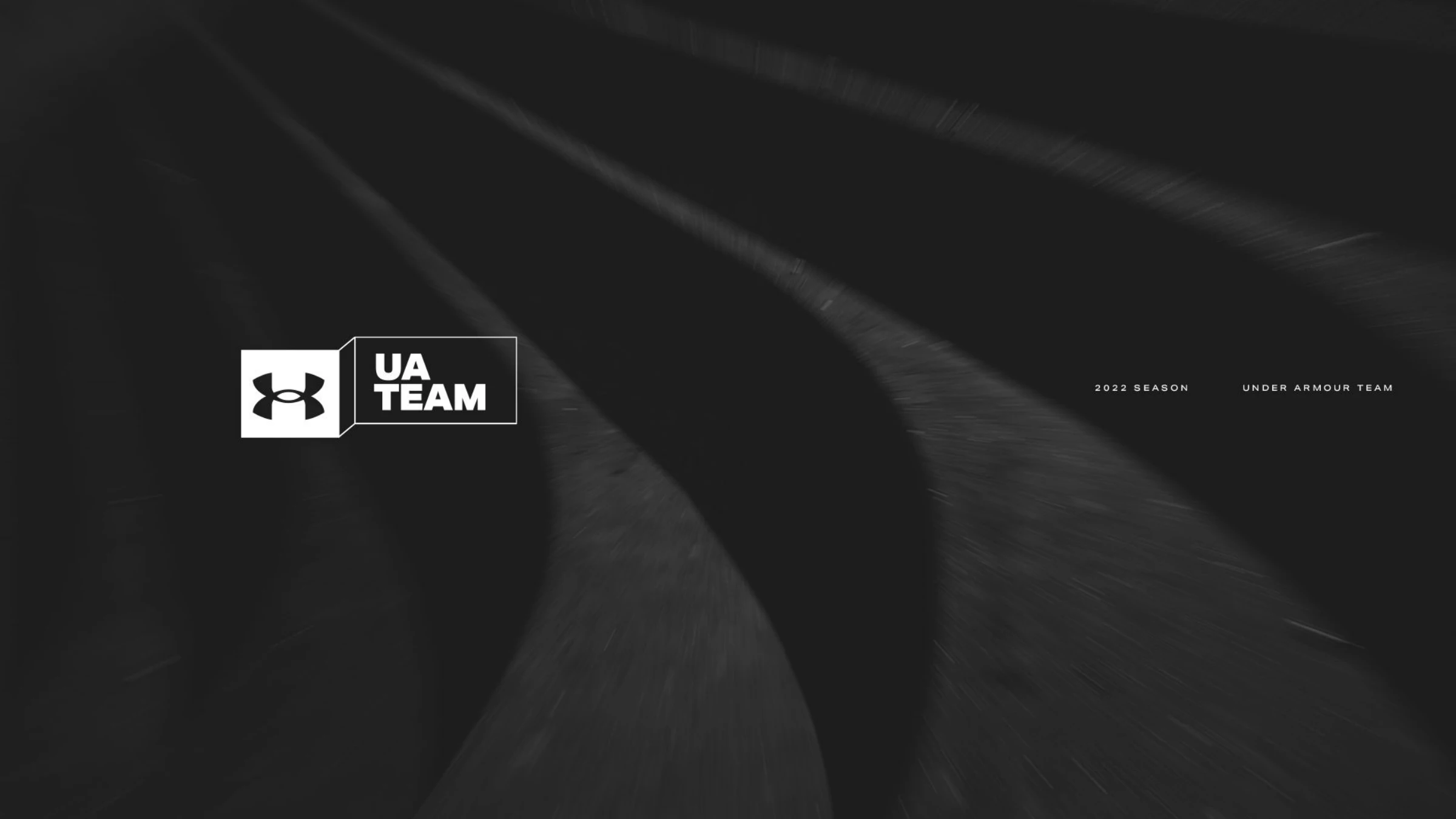 Direction 01 — the UA Team banner/tag lockup in white over a dark motion-blur running track