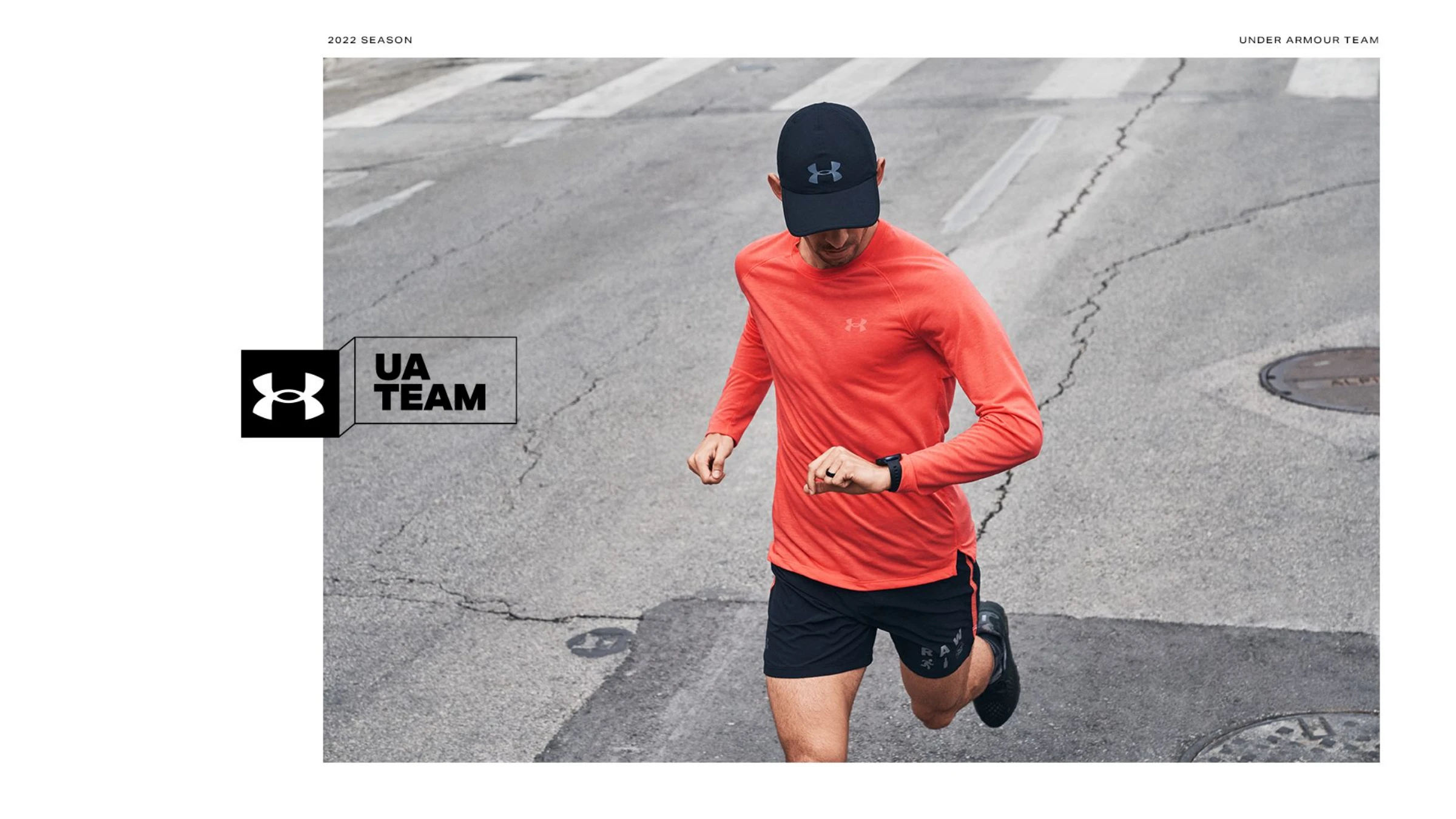 Direction 01 — the UA Team banner mark applied beside a runner in an orange long-sleeve checking his watch