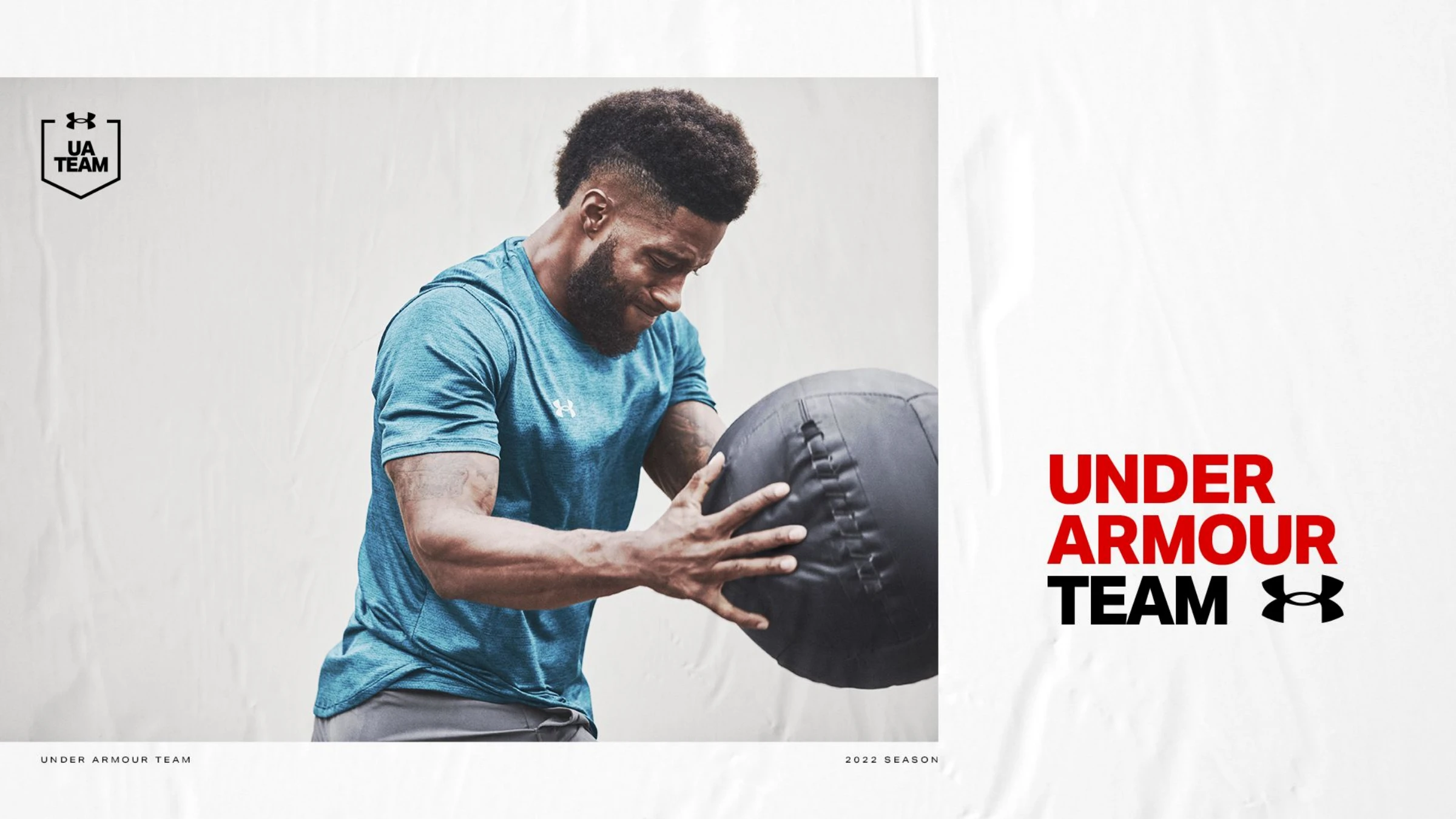 Direction 02 — the 'UNDER ARMOUR TEAM' red-and-black type lockup beside an athlete training with a medicine ball